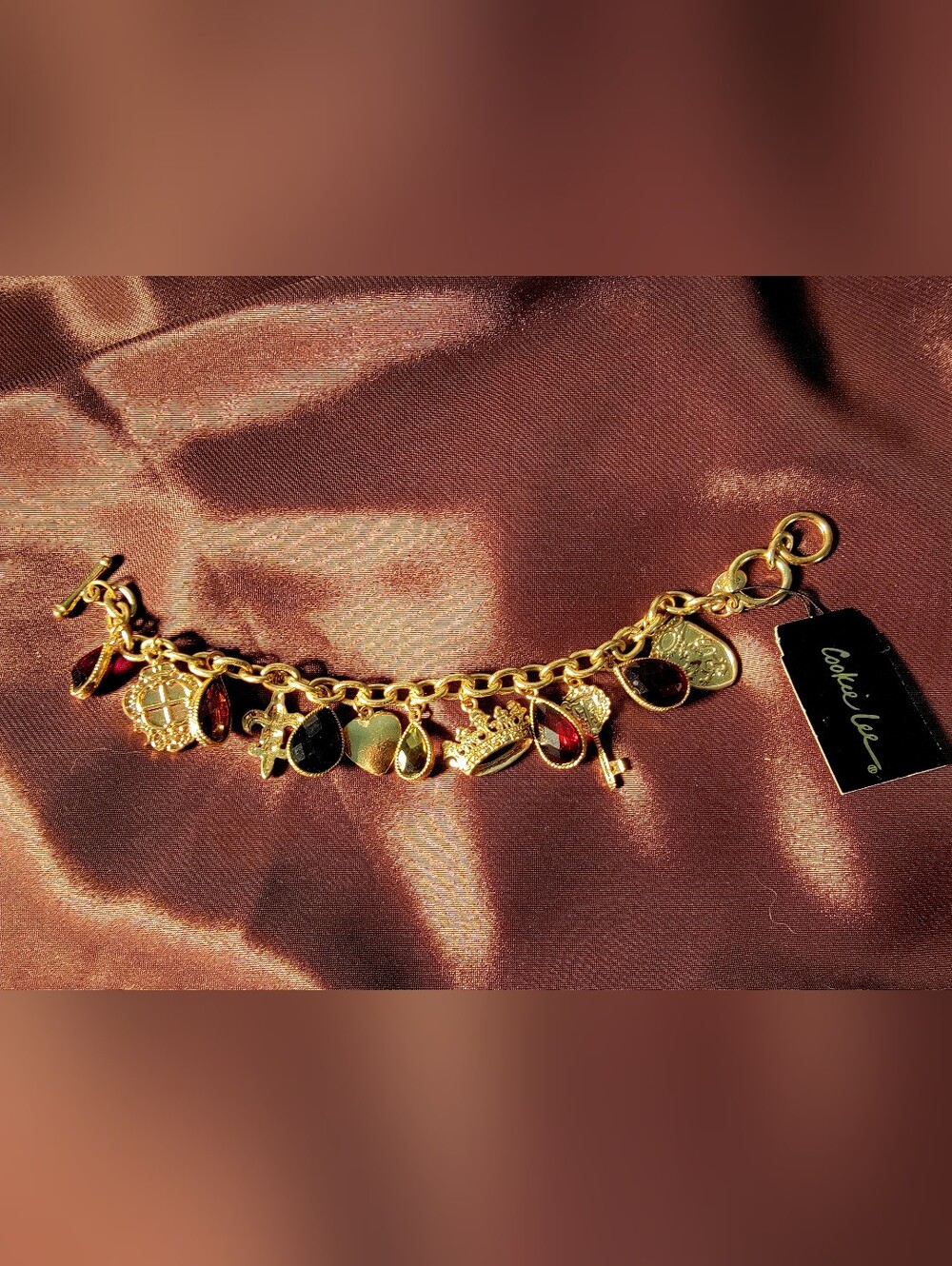 Cookie Lee Gold Charm Bracelet with Red and Black Accents